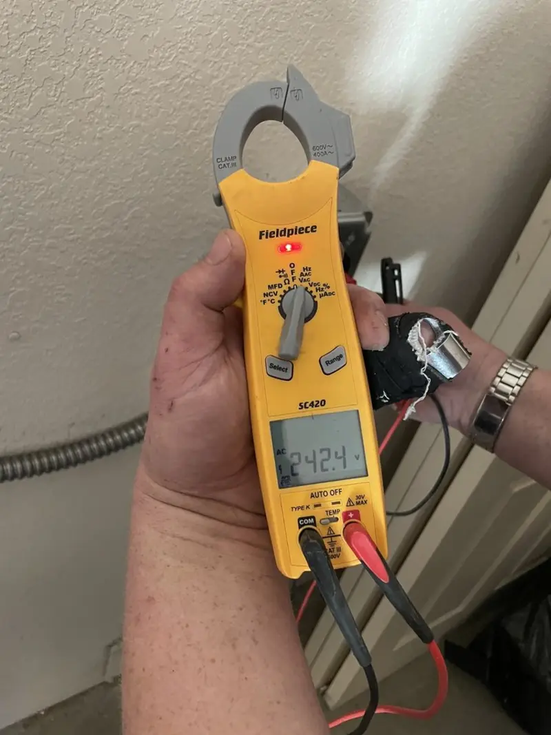 Voltage testing with clamp meter during Generator Installation in Durham